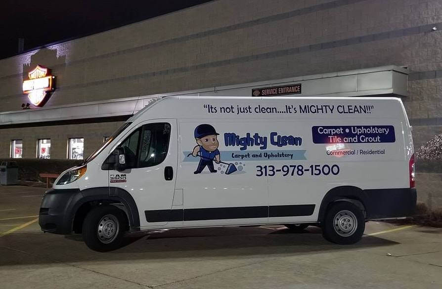 Mighty Clean work van in front of business